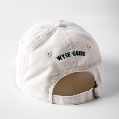 White cap with 'WYSE GUIDE' text on a light gray background